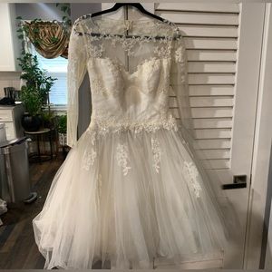 I am selling a once used beautiful ivory wedding dress!